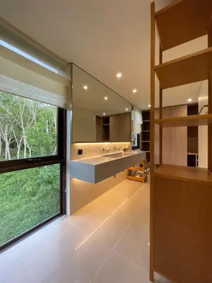 a bathroom with a sink and a large window at Tree O'clock Pool Villa - Phuket in Thalang