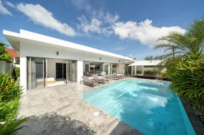 a swimming pool in the backyard of a house at Spacious 4BR Private Pool Villa Luna in Rawai Beach