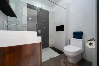 a bathroom with a toilet and a sink and a shower at Spacious 4BR Private Pool Villa Luna in Rawai Beach