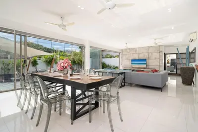 a dining room with a table and chairs at Spacious 4BR Private Pool Villa Luna in Rawai Beach