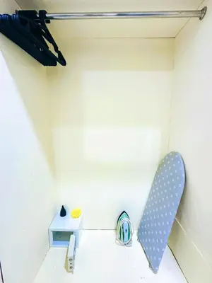 a room with a polka dot chair and a table at TJ Patong HOSTEL in Patong Beach