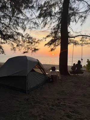 a tent sitting on the beach under a tree at TENT Maikhao in Ban Mai Salae
