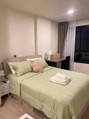 a bedroom with a bed with two towels on it at Dcondo - Kathu, Phuket in Kathu