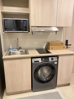 a kitchen with a washing machine and a sink at Dcondo - Kathu, Phuket in Kathu
