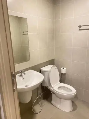 a bathroom with a toilet and a sink at Dcondo - Kathu, Phuket in Kathu