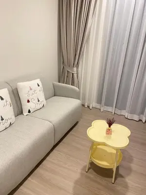 a living room with a couch and a table at Dcondo - Kathu, Phuket in Kathu