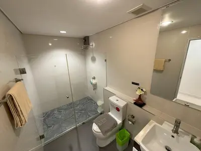 a bathroom with a shower and a toilet and a sink at Excellent apartment on Kamala in Kamala Beach