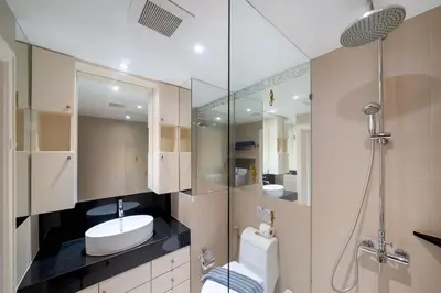 a bathroom with a sink and a toilet and a shower at Allamanda Premium Apartments Laguna Phuket in Laguna Phuket