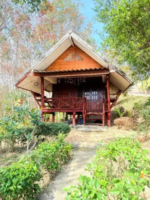 a small house with a thatched roof at Phukhao thong in Ban Bang Chak