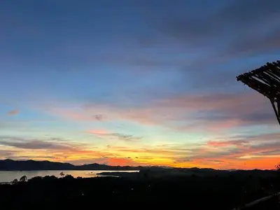 a sunset over a body of water with the sky at Phukhao thong in Ban Bang Chak