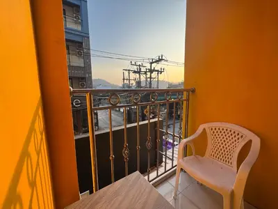 a chair sitting on a balcony with a view at Stay at Bedroom in Patong Beach