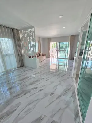 a living room with marble floors and glass doors at MB Home in Ban Bang Khu