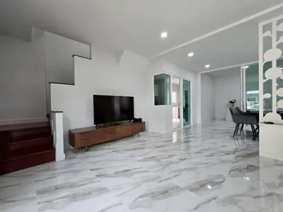 a large living room with a flat screen tv at MB Home in Ban Bang Khu