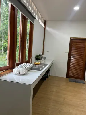 a kitchen with a sink and a counter top at maksaihomestay in Ban Lo Pa Ret