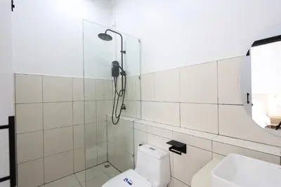 a bathroom with a shower and a toilet at Lfour phuket in Phuket Town