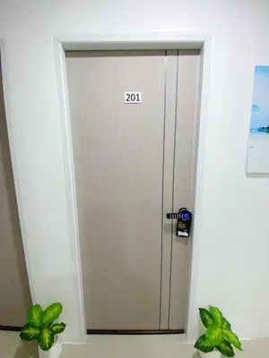 a door with the number written on it at SJ Beach House Patong in Patong Beach