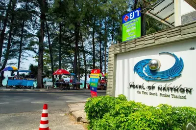 a sign for a park with a parking meter at Suite of Naithon beachfront apartment in Nai Thon Beach