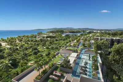 an aerial view of a resort with palm trees and the ocean at Laguna beachside residences by My home Phuket in Bang Tao Beach