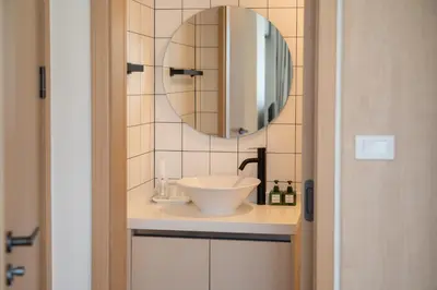 a bathroom with a sink and a mirror at Japanese-Style Condo close Kamala Beach in Kamala Beach