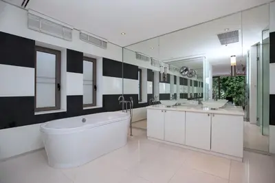 a large bathroom with two sinks and a tub at Private 3-Storey Pool Villa Atika 10, for 7, views of Patong Bay in Patong Beach