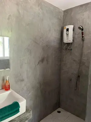 a bathroom with a shower and a sink at Nature Home in Phang-nga