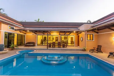 a swimming pool in front of a house at V170 4BR Timbuktu villa, Jacuzzi Walk Villa Market in Chalong