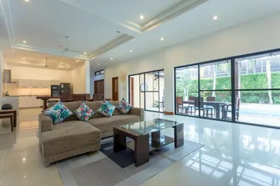 a living room with a couch and a table at V170 4BR Timbuktu villa, Jacuzzi Walk Villa Market in Chalong