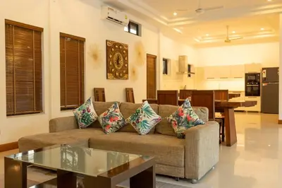 a living room with a couch and a table at V170 4BR Timbuktu villa, Jacuzzi Walk Villa Market in Chalong