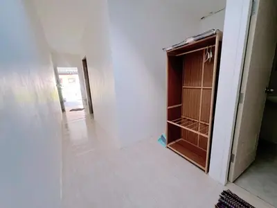 a empty closet in a room with a hallway at Tim House Thalang Phuket 1 in Thalang