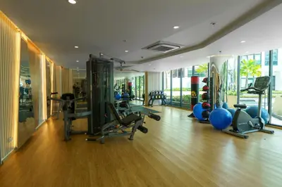 a gym with treadmills and exercise equipment in a building at Amazing View Duplex La Vita in Phuket Town