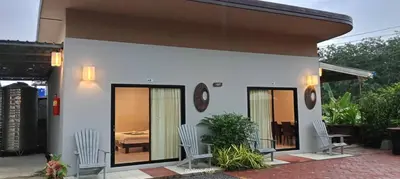 a small house with two chairs and a bed at PaKrongCheep Homestay in Ban Muang Mai