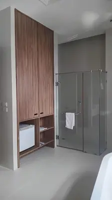 a bathroom with a shower with a glass door at Pimnara Boutique Hotel By Simply Serene in Patong Beach