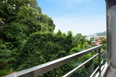 a balcony with green plants and a fence at 4BR Villa B5 with Pool, Vibrant Life at Kata Beach - UTK5 in Kata Beach