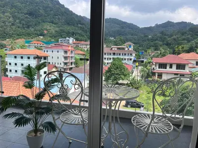a view of a city from a balcony at Chic Condo Karon A512 in Karon Beach