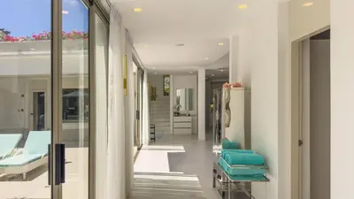 a hallway of a hospital with green beds at Beachfront Luxury villa near Banyan Tree in Layan Beach