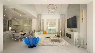 a living room with a couch and a table at Beachfront Luxury villa near Banyan Tree in Layan Beach