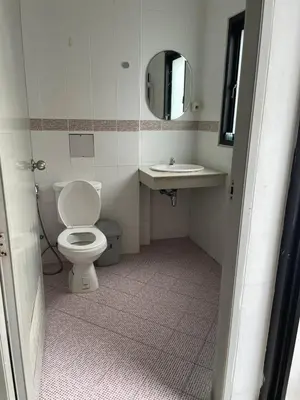 a bathroom with a toilet and a sink at CİMELi Guest House in Patong Beach