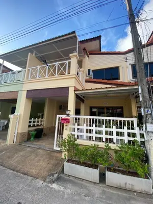 a house with a white fence in front of it at Kata beach Townhouse BL2 in Kata Beach