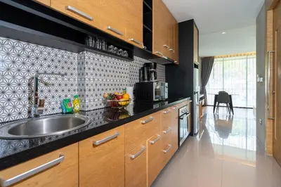 a kitchen with a sink and a counter top at Embrace Nature, Comfort & Beach Proximity - Natural Park B24 Suite, Kamala in Kamala Beach