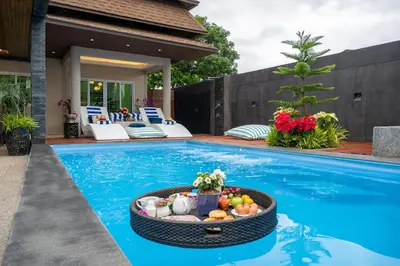 a pool with a fruit bowl in the middle of it at 2 bedrooms Amani Pool Villa Phuket in Thalang