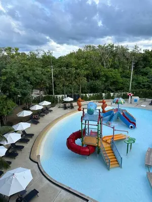 a large swimming pool with a water park with slides at 2 bedrooms apartment La Vita Rawai in Rawai Beach