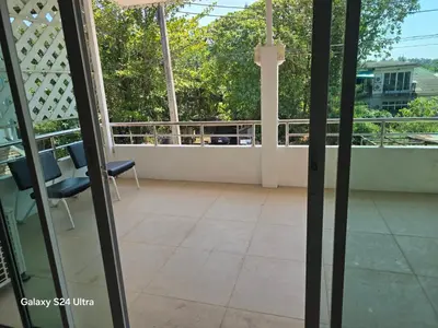 a balcony with a view of a patio at NW House in Ao Nang Beach