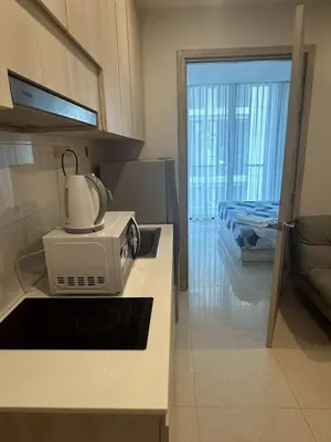 a microwave sitting on a counter in a kitchen at Peacefull new condo Patong in Patong Beach
