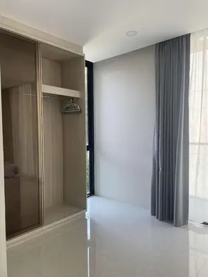 a bathroom with a shower and a glass door at Peacefull new condo Patong in Patong Beach