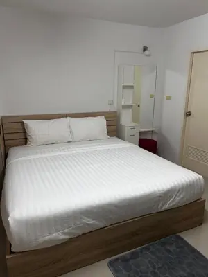 a bedroom with a large bed with white sheets at Sleepwell at naiyang No2 in Nai Yang Beach