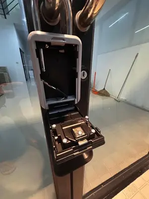 an open cell phone in a display case at Sleepwell at naiyang No2 in Nai Yang Beach