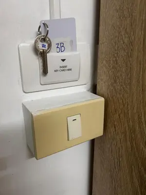 a key in a box next to a door at Sleepwell at naiyang No2 in Nai Yang Beach