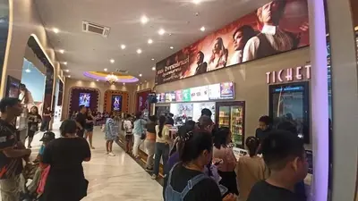 a crowd of people standing in a shopping mall at Zen House Mono in Ban Na Bon