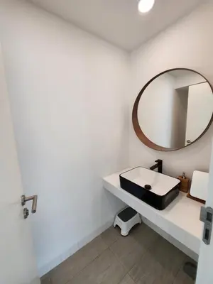 a bathroom with a sink and a mirror at Zen House Mono in Ban Na Bon