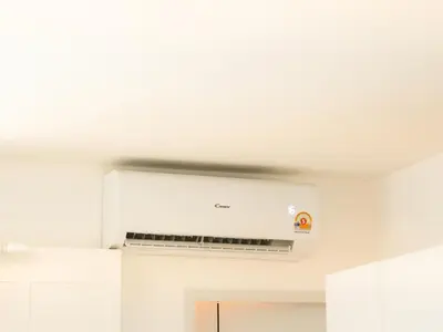 a kitchen with a white ceiling at Place Hotel in Kata Beach